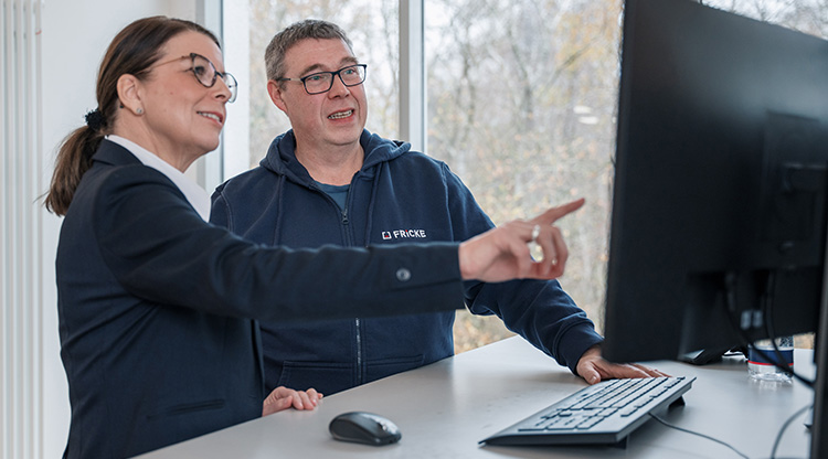 The image conveys team spirit and collaboration in a modern work environment, with a focus on technical topics.