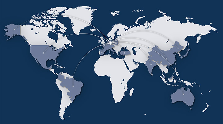 A stylized world map with highlighted regions and lines representing global presence.
